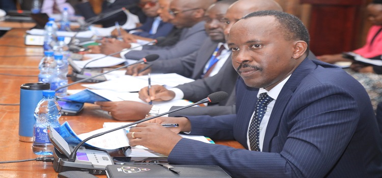 URA Commissioner General, Musinguzi Rujooki (R) appearing with his team before the committee
